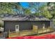 Home's rear elevation showcases a wooden deck and gray siding at 1226 Byewood Sw Ln, Atlanta, GA 30310