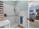 Accessible walk-in shower featuring subway tile and a convenient grab bar in a well-lit bathroom at 507 N Green Cir, Mcdonough, GA 30252