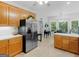 Bright kitchen equipped with stainless steel appliances, ample counter space, and sleek cabinetry at 507 N Green Cir, Mcdonough, GA 30252