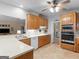 Well-equipped kitchen featuring ample counter space, modern appliances, and warm, inviting cabinetry at 507 N Green Cir, Mcdonough, GA 30252