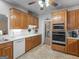 Functional kitchen with white countertops, oak cabinetry, and modern appliances for easy meal preparation at 507 N Green Cir, Mcdonough, GA 30252