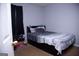 This bedroom has neutral paint and trim, and a platform bed with storage at 5639 Mallard Trl, Lithonia, GA 30058