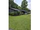This home features a well-manicured lawn, a mixture of siding and stone, and an attached garage at 5639 Mallard Trl, Lithonia, GA 30058