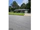 Charming single-Gathering home featuring a garage, well-kept lawn, and traditional design at 5639 Mallard Trl, Lithonia, GA 30058