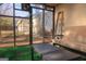 Relaxing sun room featuring a fan, sliding glass door, coffee table and neutral colored futon at 5639 Mallard Trl, Lithonia, GA 30058