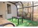 This sunroom features a table, a daybed, and lots of light at 5639 Mallard Trl, Lithonia, GA 30058