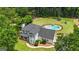 Home featuring a stunning in-ground pool, trampoline, and a well-manicured lawn at 140 Laurel Lake Rd, Tyrone, GA 30290