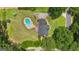Aerial view of the home showcasing an in-ground pool, driveway, and well-maintained lawn at 140 Laurel Lake Rd, Tyrone, GA 30290