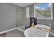 Bright bathroom featuring a freestanding tub, a walk-in shower, and modern fixtures at 140 Laurel Lake Rd, Tyrone, GA 30290