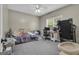 Functional bedroom with carpet floors, ceiling fan, and plenty of natural light at 140 Laurel Lake Rd, Tyrone, GA 30290