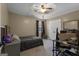 Bedroom with a ceiling fan, natural light, and space for study at 140 Laurel Lake Rd, Tyrone, GA 30290