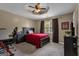 Bedroom with a ceiling fan, natural light, and space for a study area at 140 Laurel Lake Rd, Tyrone, GA 30290
