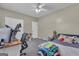 Functional bedroom with carpet floors, ceiling fan, and plenty of natural light at 140 Laurel Lake Rd, Tyrone, GA 30290