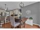 Cozy dining area featuring a wood table, pendant lighting, and stylish decor at 140 Laurel Lake Rd, Tyrone, GA 30290