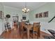 Charming dining room with a wooden table, decor on the wall, and views into the kitchen at 140 Laurel Lake Rd, Tyrone, GA 30290