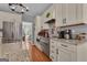 Bright kitchen with stainless steel appliances, granite countertops and wood floors at 140 Laurel Lake Rd, Tyrone, GA 30290