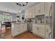 Modern kitchen with stainless steel appliances, granite countertops, and hardwood floors at 140 Laurel Lake Rd, Tyrone, GA 30290