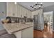 Well-lit kitchen featuring granite countertops, stainless steel appliances, and ample cabinet space at 140 Laurel Lake Rd, Tyrone, GA 30290