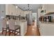 Spacious kitchen with an island, stainless steel appliances and wood floors at 140 Laurel Lake Rd, Tyrone, GA 30290