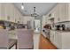 Inviting kitchen featuring stainless steel appliances, granite countertops and wood floors at 140 Laurel Lake Rd, Tyrone, GA 30290