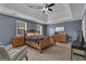 Spacious main bedroom featuring a trey ceiling, carpet floors, and double windows at 140 Laurel Lake Rd, Tyrone, GA 30290