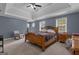 Spacious main bedroom featuring a trey ceiling, carpet floors, and double windows at 140 Laurel Lake Rd, Tyrone, GA 30290