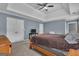 Spacious main bedroom featuring a trey ceiling, carpet floors, and double windows at 140 Laurel Lake Rd, Tyrone, GA 30290