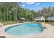 Spacious in-ground pool in a private backyard setting, surrounded by mature trees at 140 Laurel Lake Rd, Tyrone, GA 30290