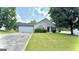 Lovely one-story home with a welcoming front yard, attached garage, and classic suburban charm at 6638 Creek Turn Dr, Rex, GA 30273