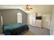 This main bedroom features neutral-colored walls, vaulted ceiling, and a window for natural light at 6638 Creek Turn Dr, Rex, GA 30273