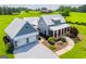 Gorgeous property with a home, detached garage, lush lawn, and scenic surroundings at 385 Liberty Church Rd, Carrollton, GA 30116