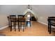 Attic featuring a bar with chairs and hardwood floors at 385 Liberty Church Rd, Carrollton, GA 30116