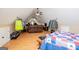 Open attic with hardwood floors, sofa, and storage space at 385 Liberty Church Rd, Carrollton, GA 30116