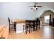Bar with black chairs and wood counter overlooking the large room and view from window at 385 Liberty Church Rd, Carrollton, GA 30116
