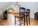 Bar with black chairs and wood counter overlooking the large room with ceiling fan at 385 Liberty Church Rd, Carrollton, GA 30116