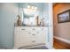 Bathroom featuring double vanity with granite countertop, white cabinets, and modern fixtures at 385 Liberty Church Rd, Carrollton, GA 30116