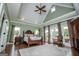 Spacious bedroom with tray ceilings, hardwood floors, large windows and decorative rug at 385 Liberty Church Rd, Carrollton, GA 30116
