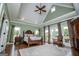 Spacious bedroom with tray ceilings, hardwood floors, large windows and decorative rug at 385 Liberty Church Rd, Carrollton, GA 30116