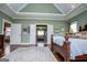 Spacious bedroom with tray ceilings, hardwood floors and direct access to ensuite bath at 385 Liberty Church Rd, Carrollton, GA 30116