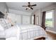 Well-lit bedroom with large windows, hardwood floors, and built in closets for plenty of storage at 385 Liberty Church Rd, Carrollton, GA 30116