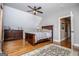 Comfortable bedroom with hardwood floors, neutral walls, and large dresser creating a relaxing retreat at 385 Liberty Church Rd, Carrollton, GA 30116