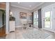 Bright and airy dining area with tile floors, natural light, and view to yard at 385 Liberty Church Rd, Carrollton, GA 30116