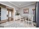 Bright and airy dining area with tile floors, natural light, and modern decor at 385 Liberty Church Rd, Carrollton, GA 30116