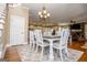 Elegant dining room featuring a wooden table, seating for six, and a view into the modern kitchen at 385 Liberty Church Rd, Carrollton, GA 30116