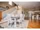 Dining area featuring a staircase and view into the kitchen at 385 Liberty Church Rd, Carrollton, GA 30116