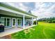 Exterior view of a home featuring a covered patio and expansive backyard at 385 Liberty Church Rd, Carrollton, GA 30116