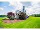 Side view of a beautiful two-story home showing the well-maintained lawn and landscaping at 385 Liberty Church Rd, Carrollton, GA 30116