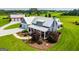 Desirable home with front porch, landscaped grounds, and a large manicured lawn at 385 Liberty Church Rd, Carrollton, GA 30116