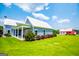 Exterior of a home with a covered patio and a red barn in the background at 385 Liberty Church Rd, Carrollton, GA 30116
