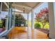 Inviting front porch with a wooden swing and seating, creating a cozy outdoor space at 385 Liberty Church Rd, Carrollton, GA 30116
